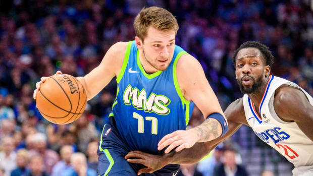 Nov 26, 2019; Dallas, TX, USA; Dallas Mavericks forward Luka Doncic (77) drives to the basket past \LA Clippers guard Patrick Beverley (21) during the first quarter at the American Airlines Center. Mandatory Credit: Jerome Miron-USA TODAY Sports